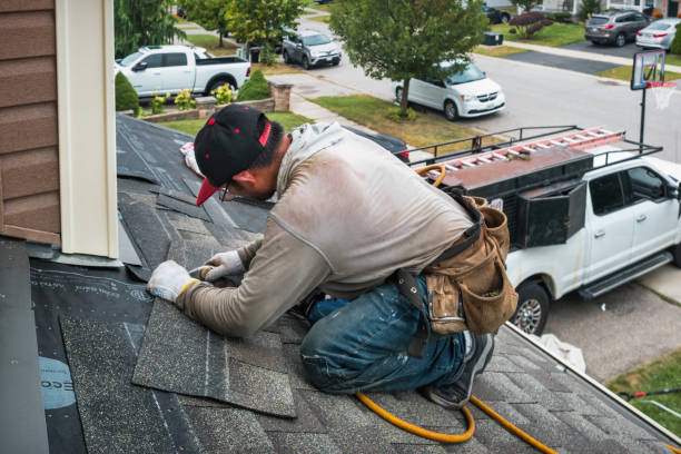 Professional Roofing technician working in Commack, NY